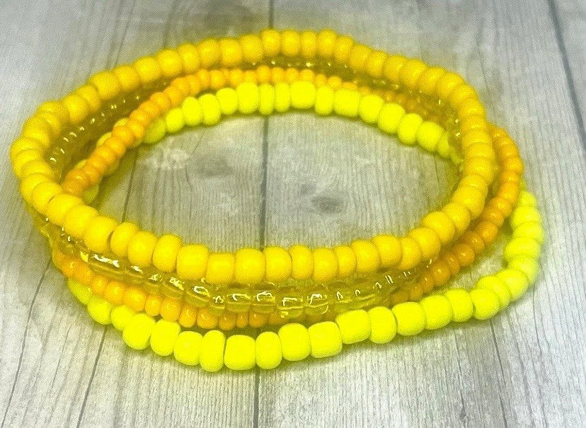 Yellow color stacked bracelets
