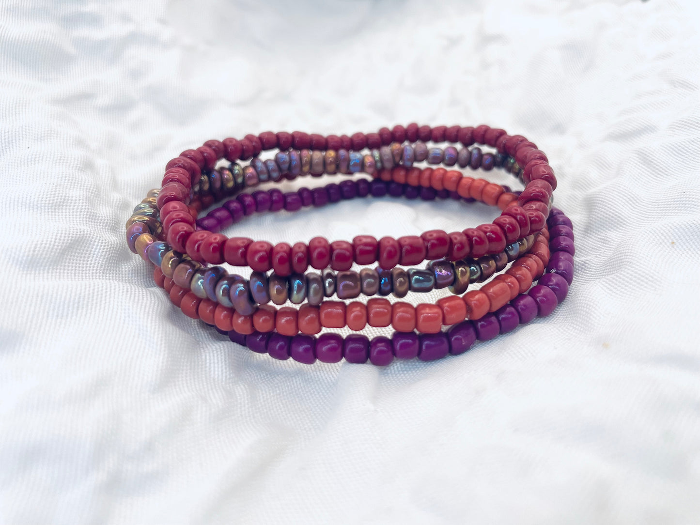 Magenta bracelet stack, maroon bracelets