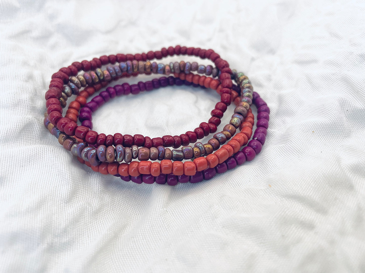 Magenta bracelet stack, maroon bracelets