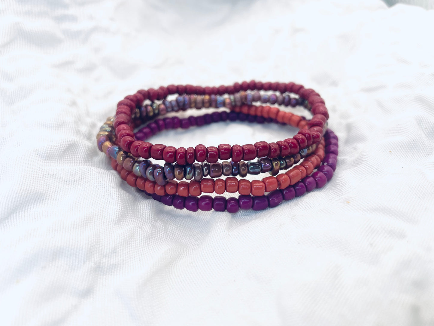 Magenta bracelet stack, maroon bracelets