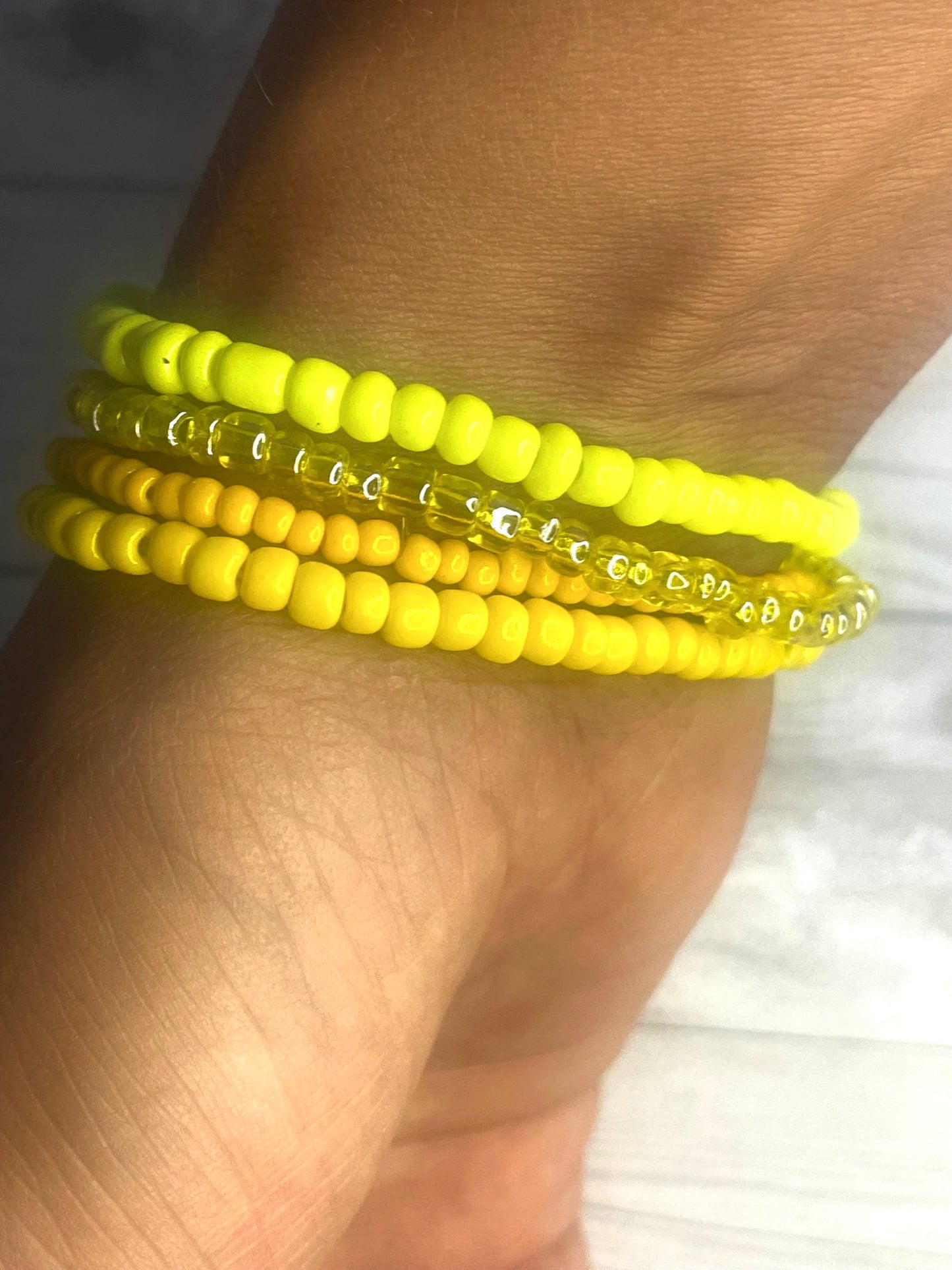 Yellow color stacked bracelets