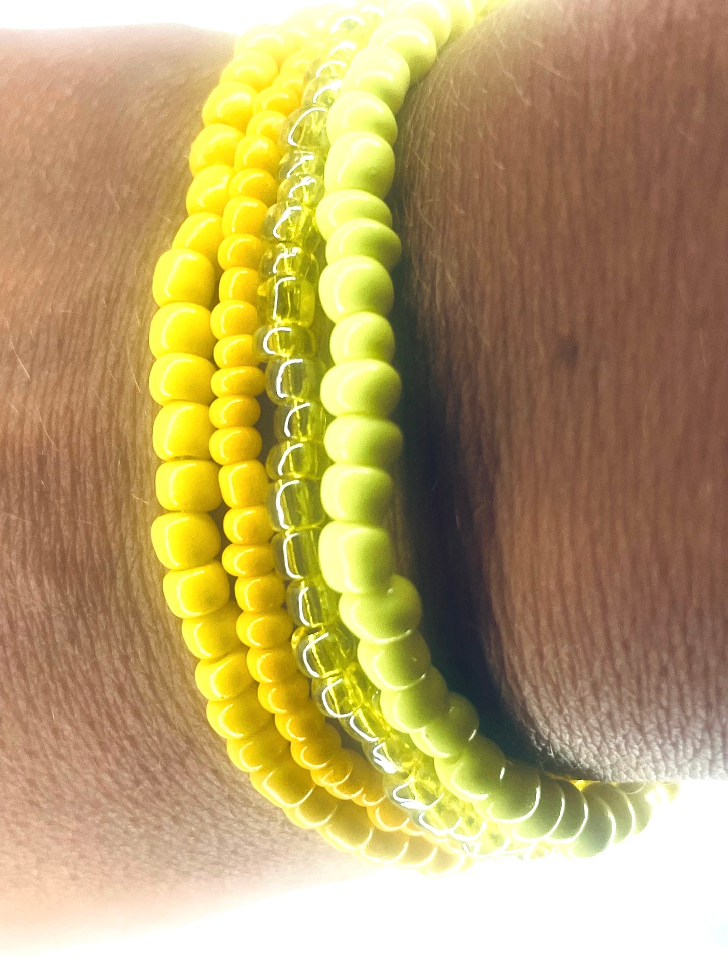 Yellow color stacked bracelets