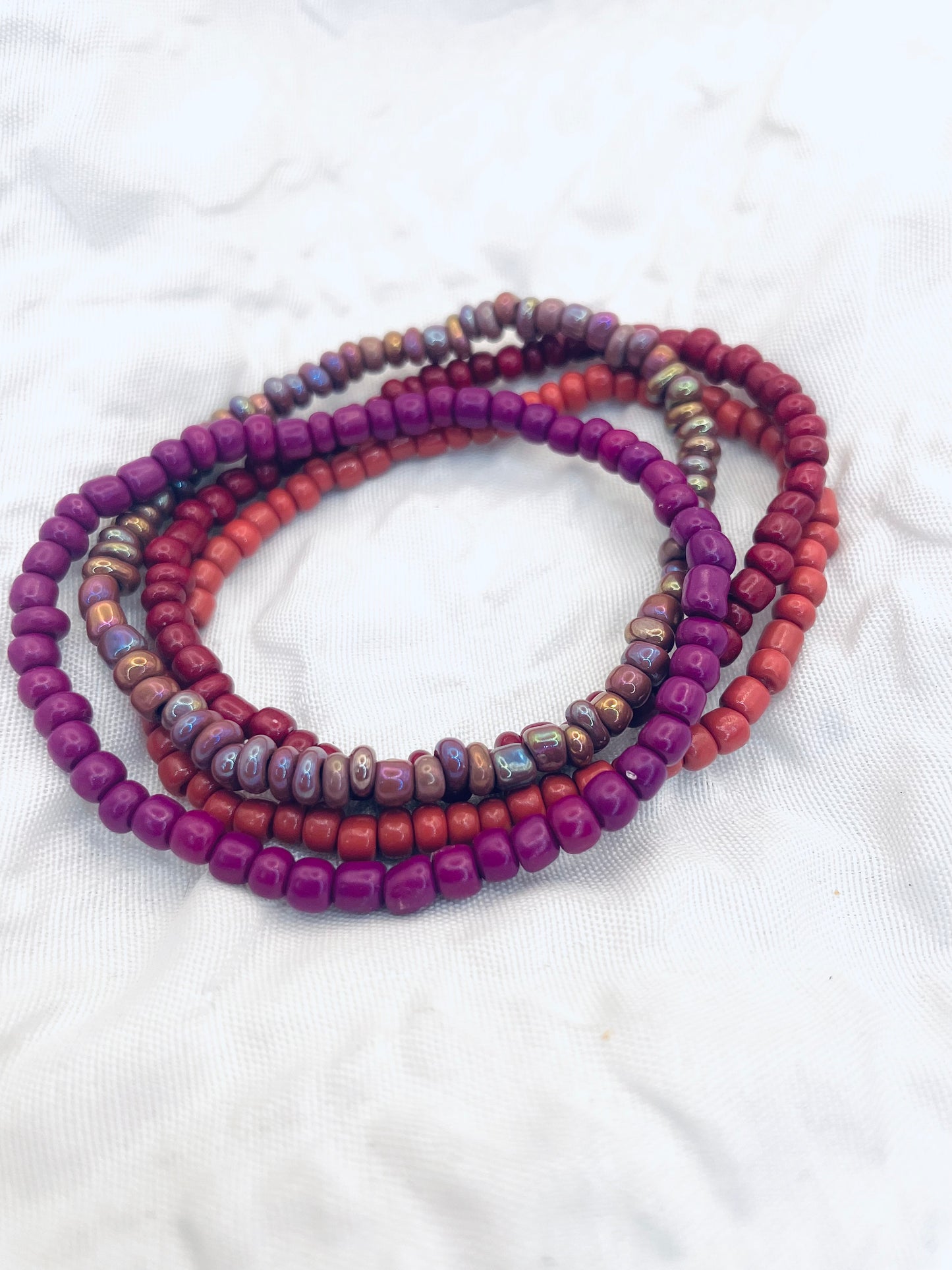 Magenta bracelet stack, maroon bracelets