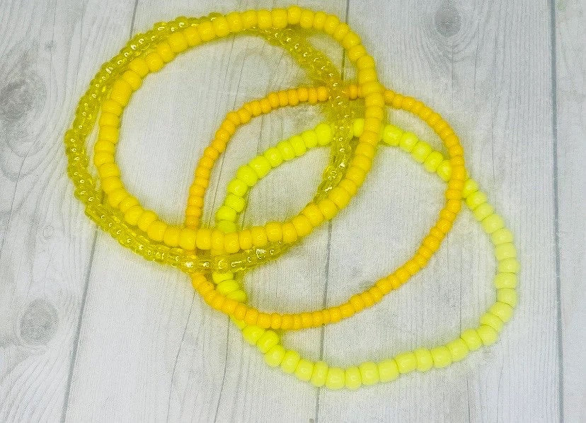 Yellow color stacked bracelets