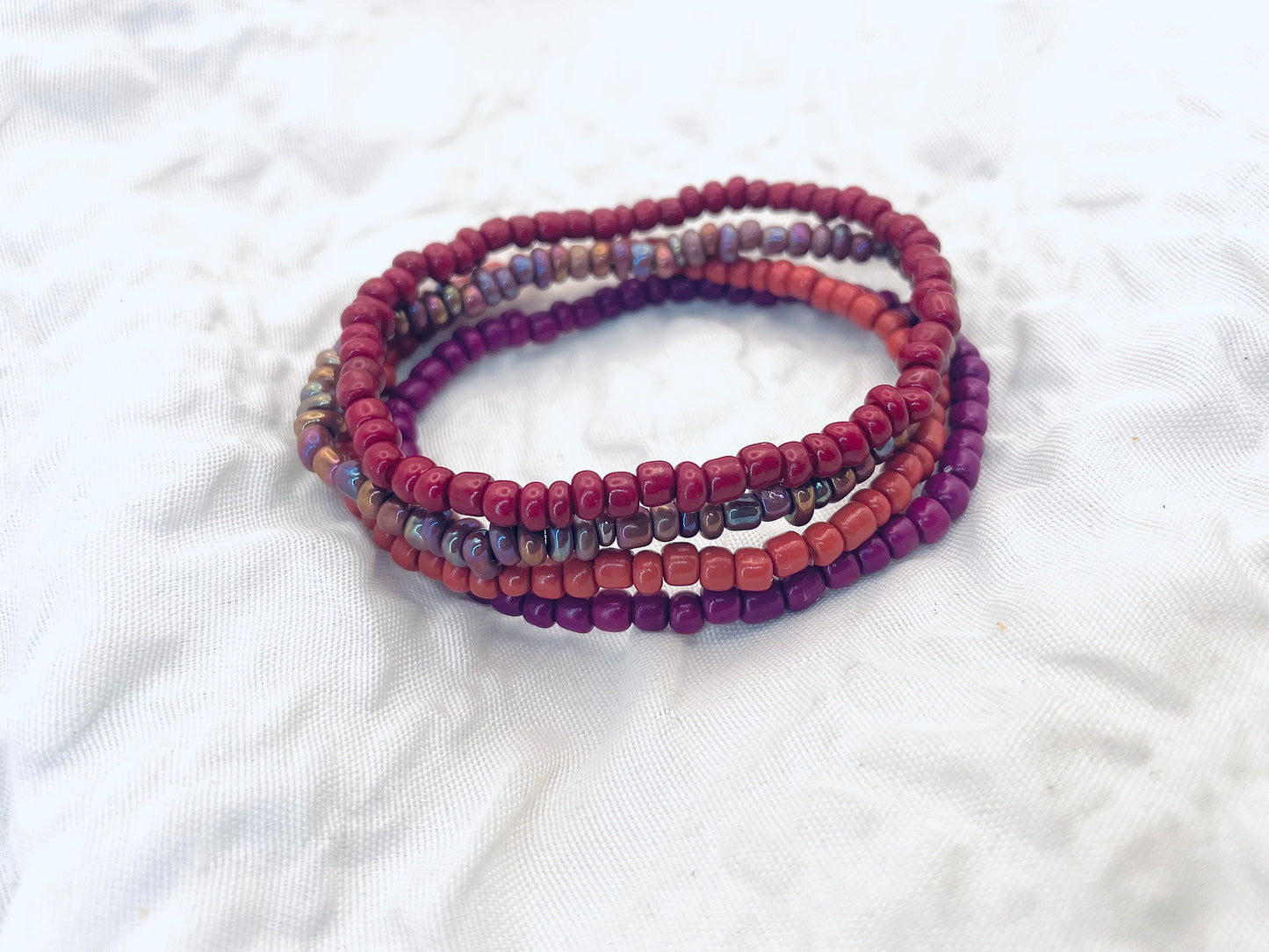 Magenta bracelet stack, maroon bracelets