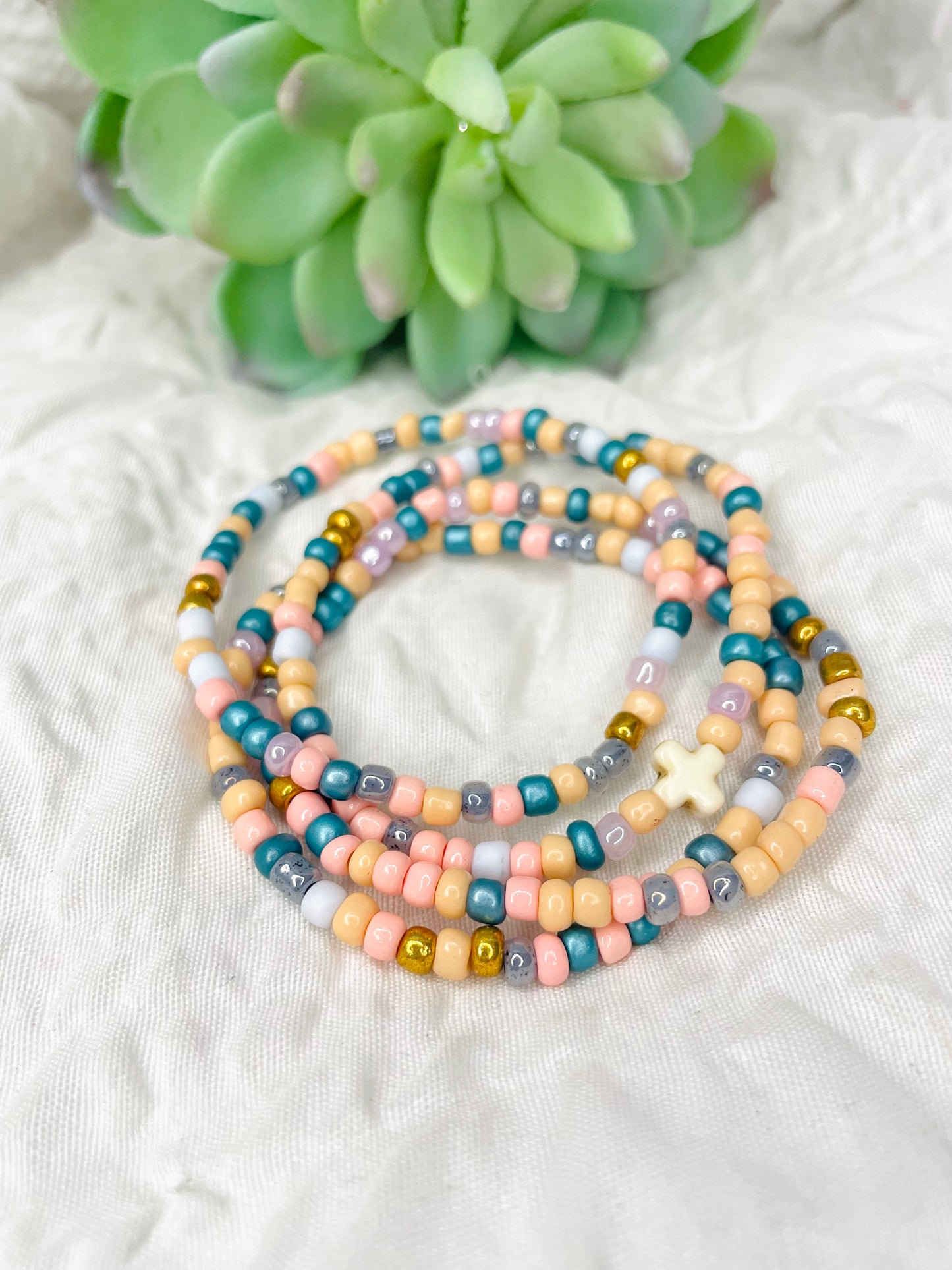 Multicolored peach stacked bracelets