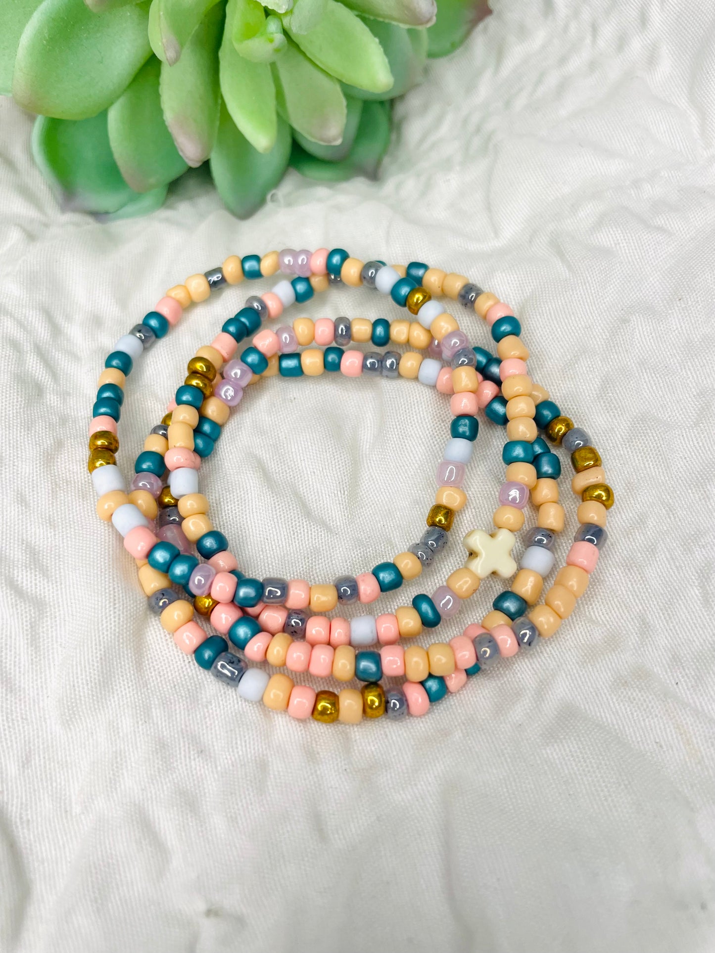 Multicolored peach stacked bracelets