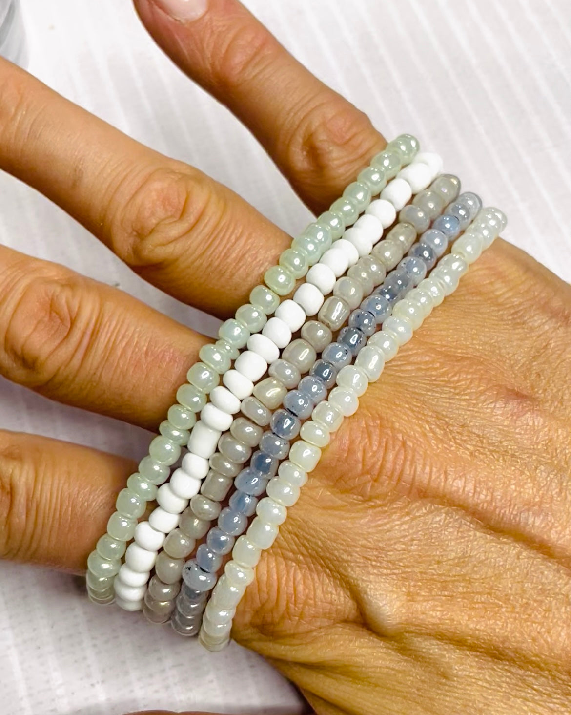 Neutral shade bracelet stack, cloud white shades