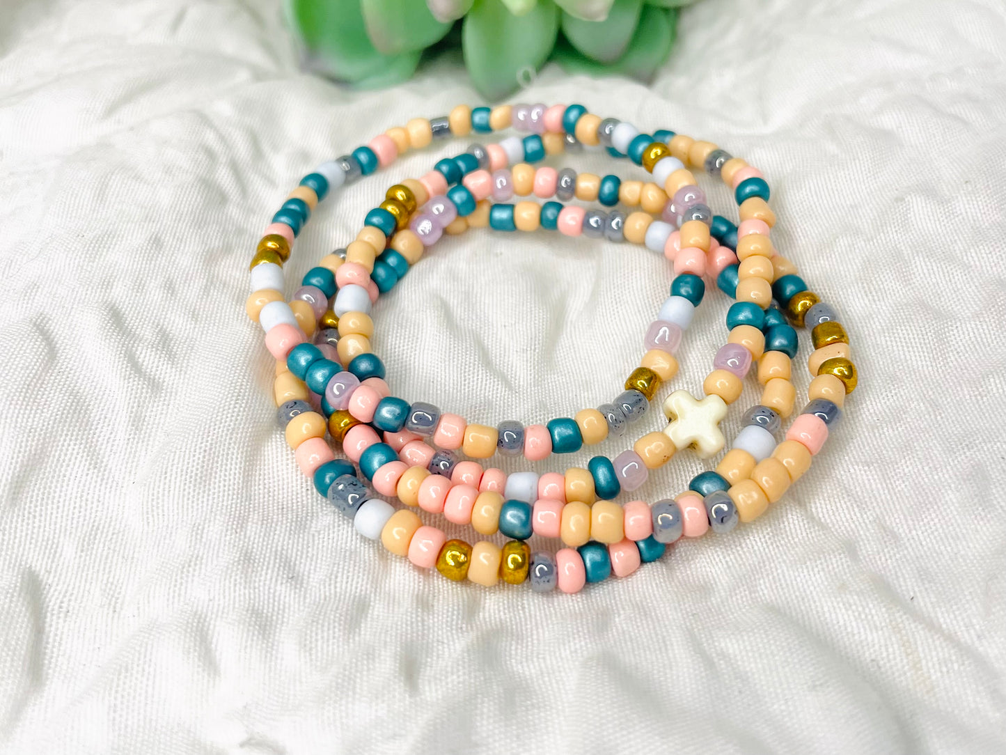 Multicolored peach stacked bracelets