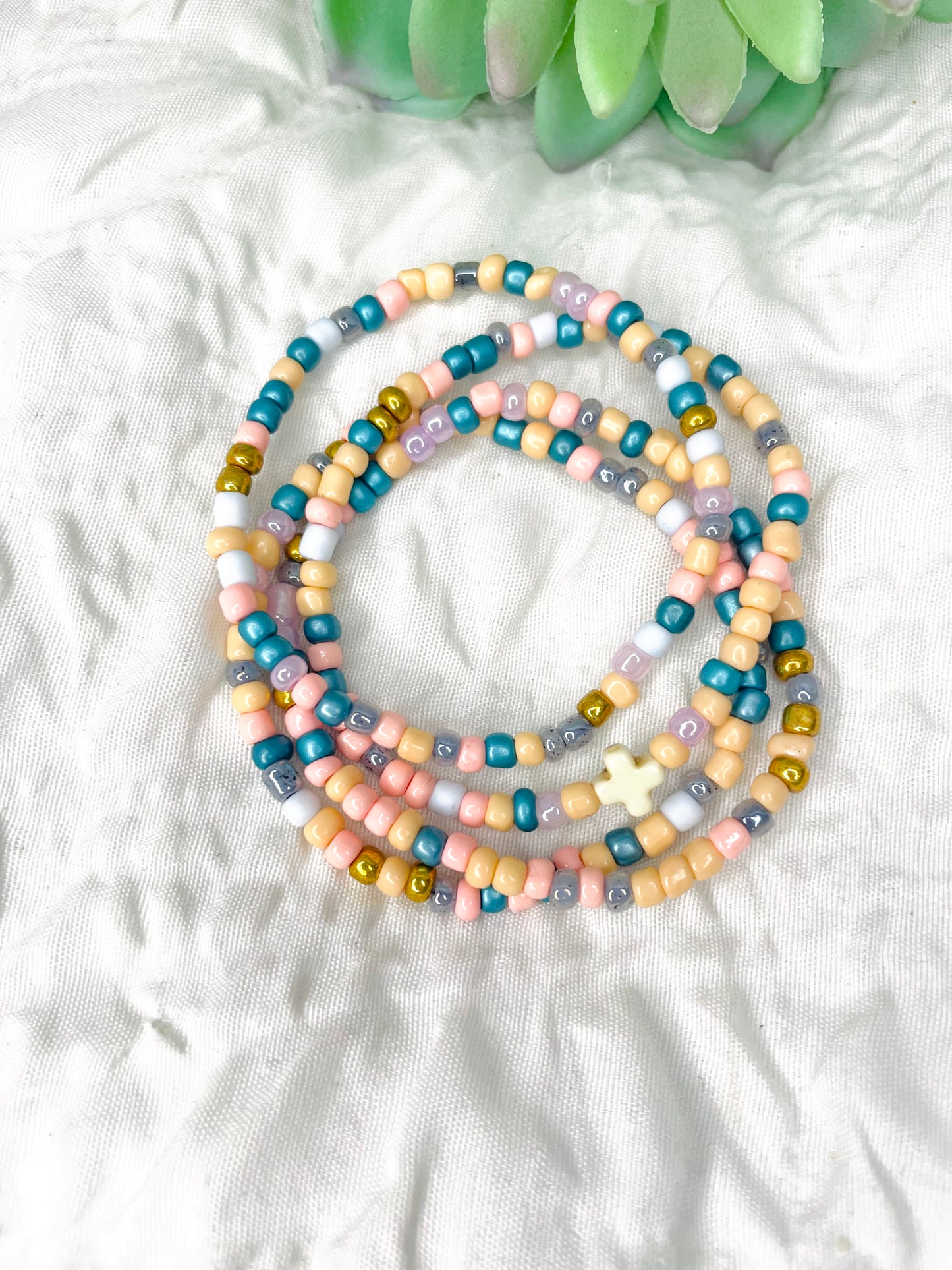 Multicolored peach stacked bracelets